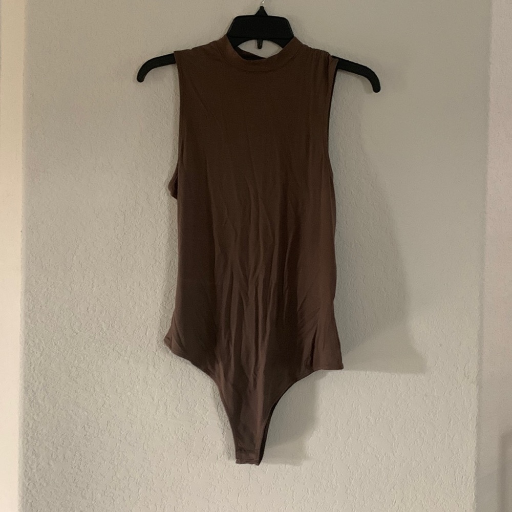 Olive green body suit.